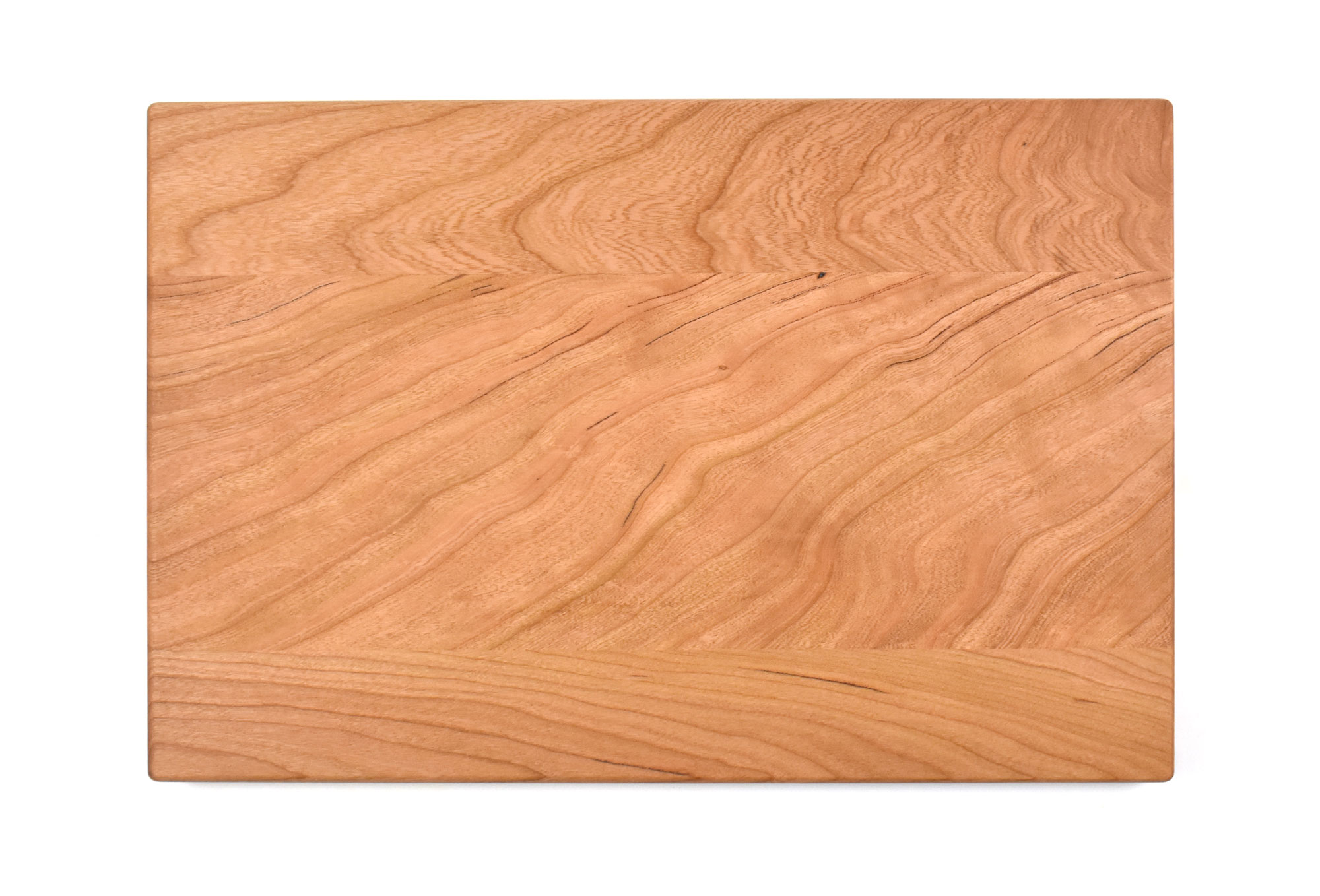 Small cherry board with rounded edges and juice groove