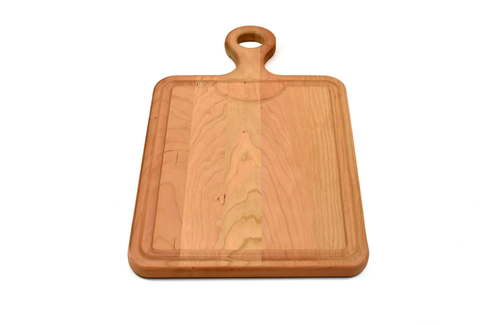 Cherry cutting board with a juice groove, reservoir and rounded handle