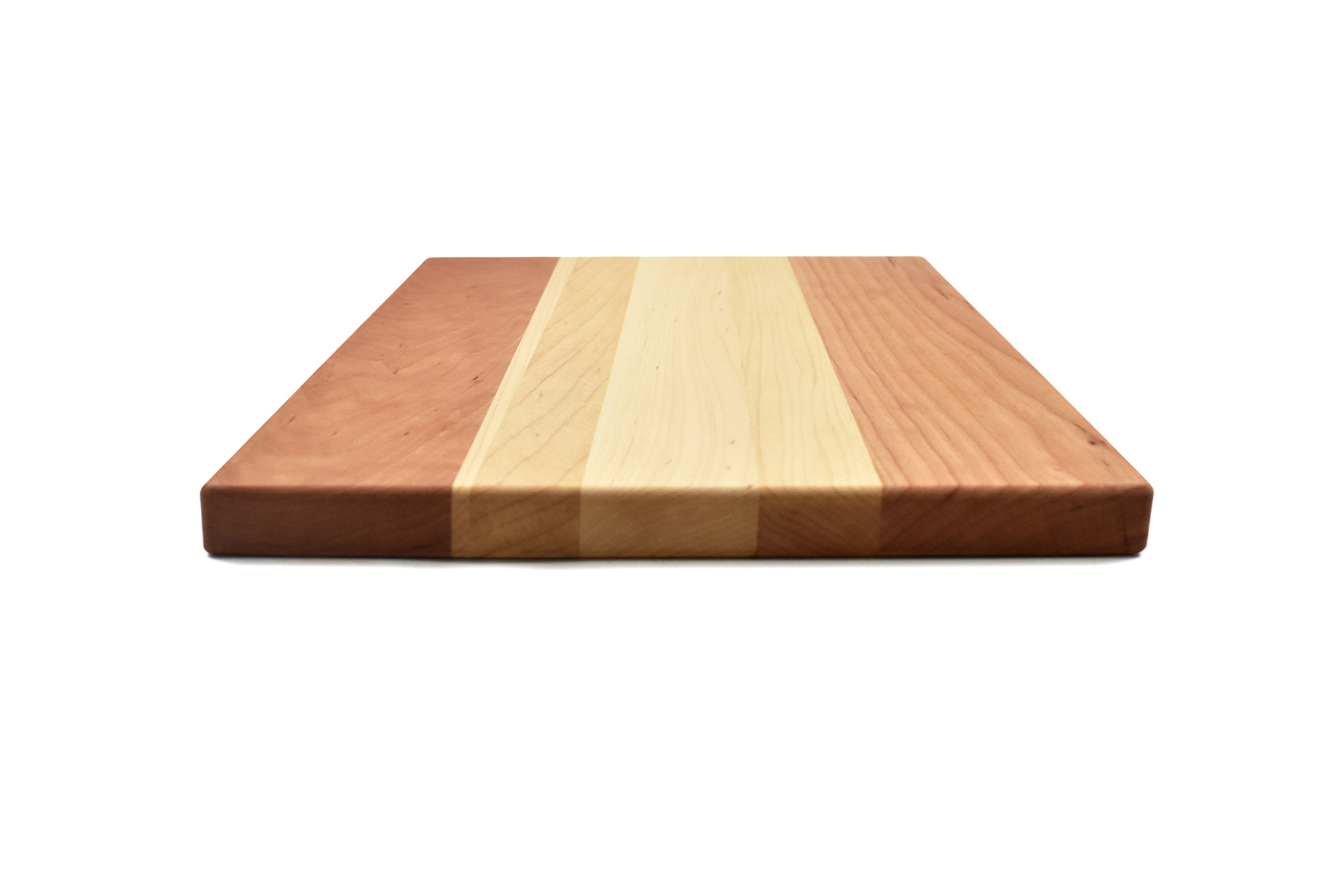 Multi wood species cutting board - Cherry wood ends with Maple wood in the middle
